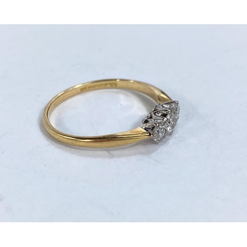 608B - A lady's dress ring set with 3 diamonds in yellow metal shank, 18k, size M 1.77gm size