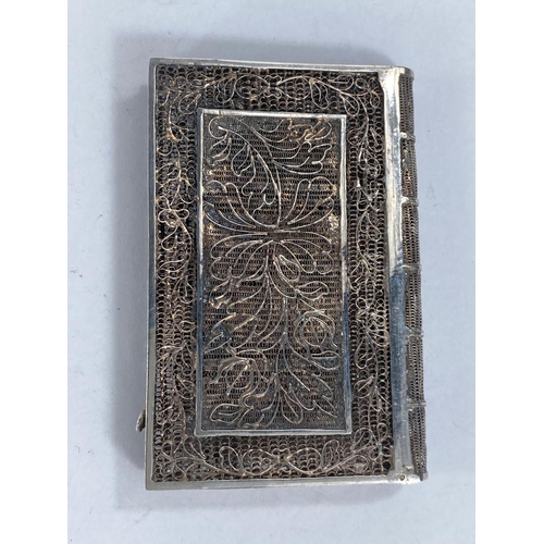 608F - An early 19th century Chinese white metal filigree case in the form of a book with intricate pattern... 