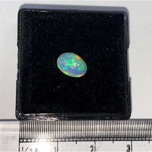 721A - A cabochon cut opal, .95 carat