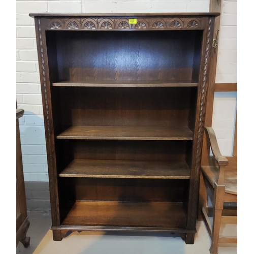 843 - An oak period style 4 height carved bookcase