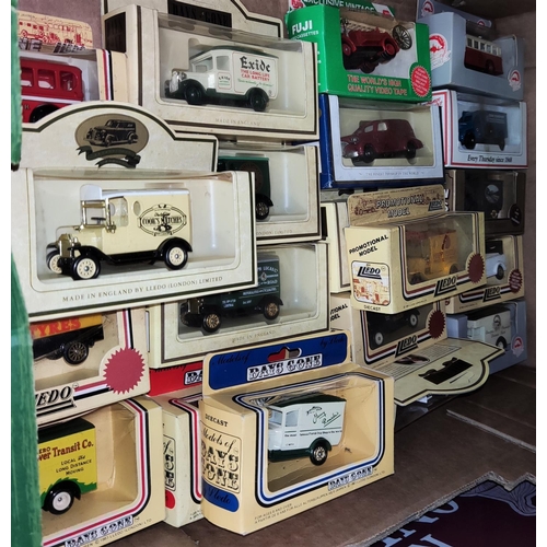 202 - A large selection of Lledo and other diecast advertising vehicles etc.