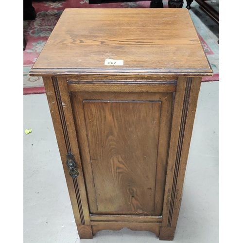 862 - An oak occasional table with rectangular top; an Edwardian oak bedside cabinet; a linen basket