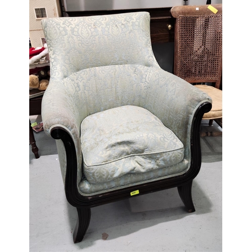 909 - An early 20th century Regency style armchair in green brocade.