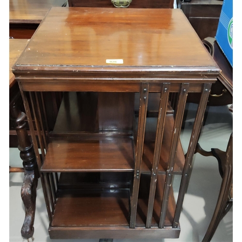 926 - An Edwardian 2 tier walnut revolving bookcase