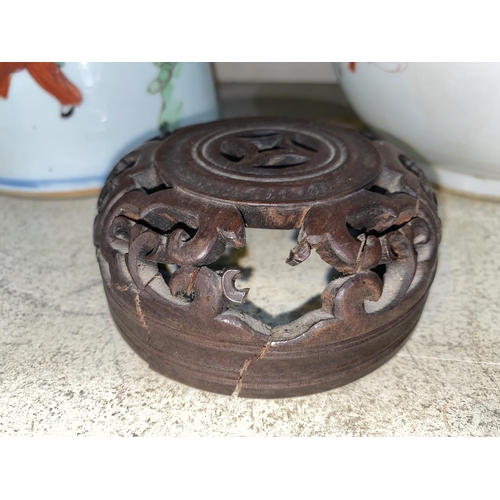 410 - A Chinese ginger jar with pierced wooden lid , characters leaf signature to base, height 23cm; anoth... 