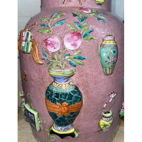 417 - A large Chinese pink ground rouleau vase decorated with antiques in relief, ht 48cm