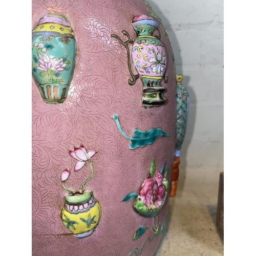 417 - A large Chinese pink ground rouleau vase decorated with antiques in relief, ht 48cm