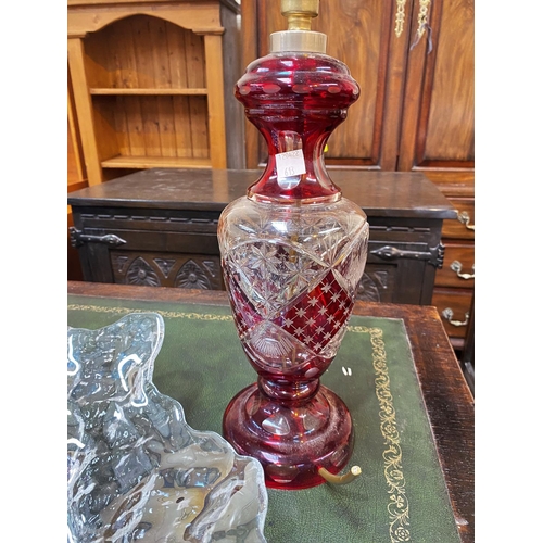 613 - A Bohemian table lamp in red overlaid glass; an Art Glass large shaped dish