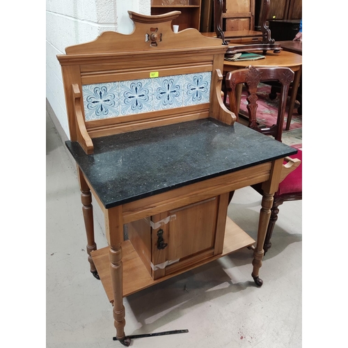 837 - An Edwardian small washstand in satin beech with marble top and tile back