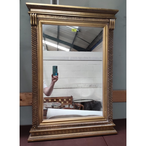 891 - A large modern gilt framed Regency style wall mirror 101cm height x 71cm wide