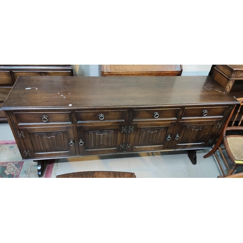 918 - A Jacobean style oak refectory table on carved bulbous legs (top marked) and a matching sideboard of... 