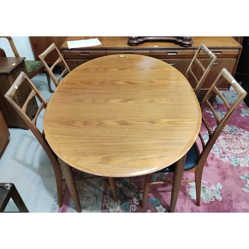 932 - A 1960's teak dining suite comprising oval extending table and a set of 4 Danish high ladderback cha... 