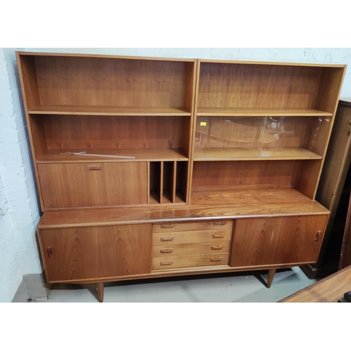 933 - A 1960's teak high back sideboard on lowline base with glass cabinet, cocktail section, record stand... 