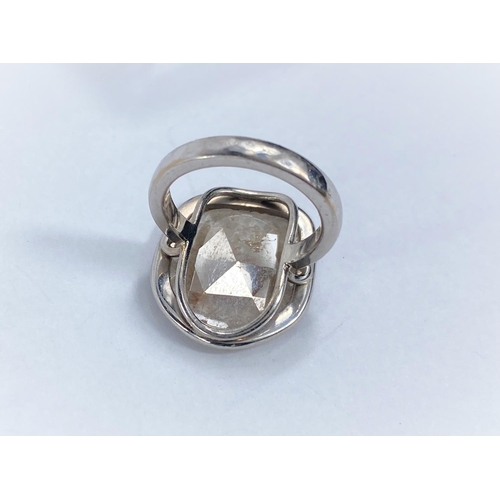 707 - By William Welstead, English jewellery designer, an 18 carat hallmarked white gold ring set with lar... 