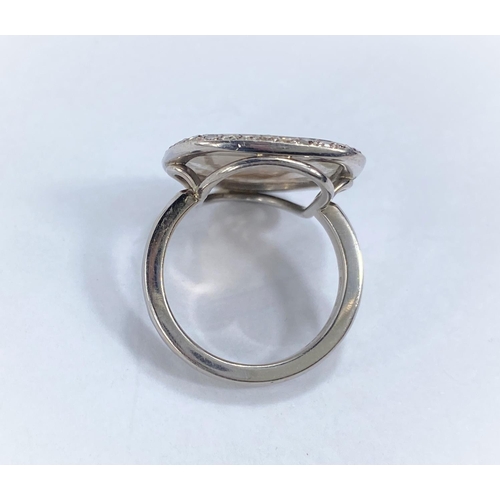 707 - By William Welstead, English jewellery designer, an 18 carat hallmarked white gold ring set with lar... 