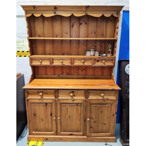 907 - A mid pine Welsh Dresser with three shelves and four drawers, over 3 cupboards and 3 drawers, width ... 