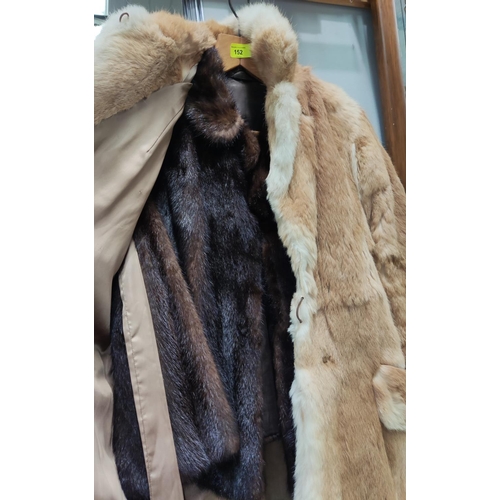 152 - A light fur half length jacket and another dark fur jacket