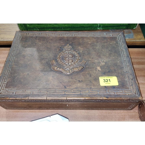 321 - A Middle Eastern carved wood box, arms of the RAMC, a quality of Royal Marine cap badges and shoulde... 