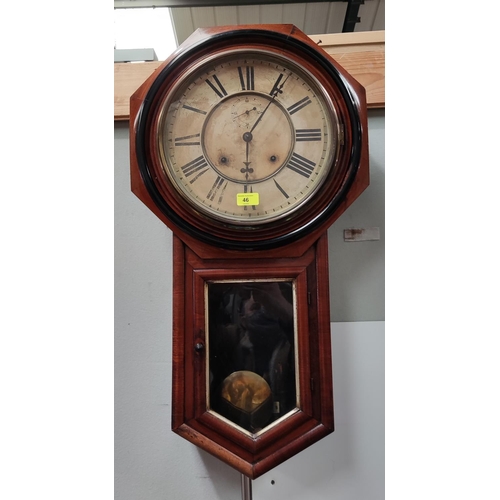 46 - An American walnut cased drop dial striking wall clock