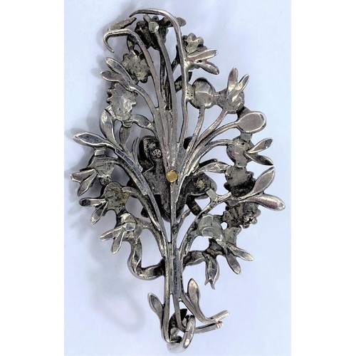 707A - A 19th century Indian kalangi/kalgi in white and yellow metal, with flower head centre on a spray of... 