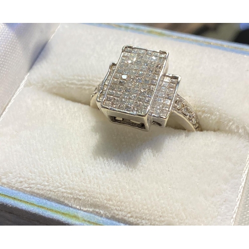 706 - A white metal Art Deco style dress ring with 66 small square cut diamonds in rectangular setting, 2 ... 