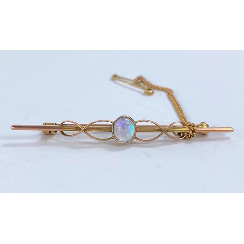 743 - A 9ct gold bar brooch set with oval opal to centre in original box, 3.2gms