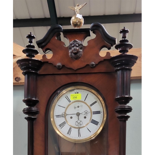 356 - A 19th century walnut Vienna wall clock with twin weight driven movement.