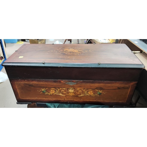 370C - An inlaid mahogany box with floral decoration, Length 66cm