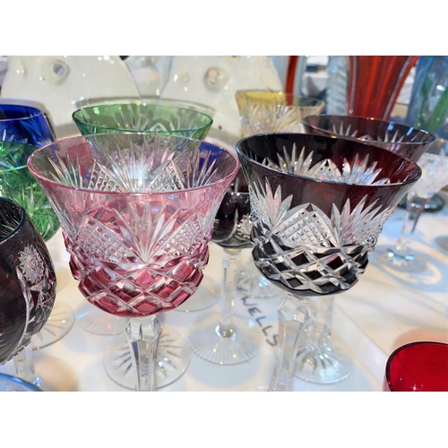 456 - A selection of cut glass coloured drinking glasses, mainly wines