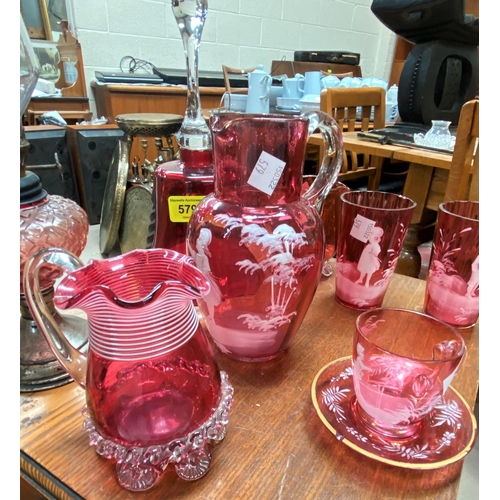 579 - A selection of Cranberry glass including some decorated in the Mary Gregory style