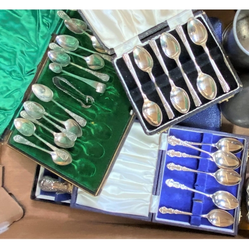 601 - A set of boxed unmarked white metal teaspoons, 12 with replacement sugar tongs (ill fitting) a selec... 