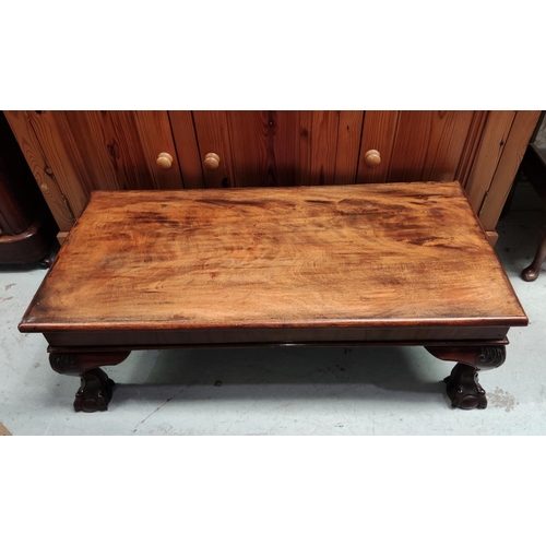 858 - A mahogany coffee table with ball and claw feet