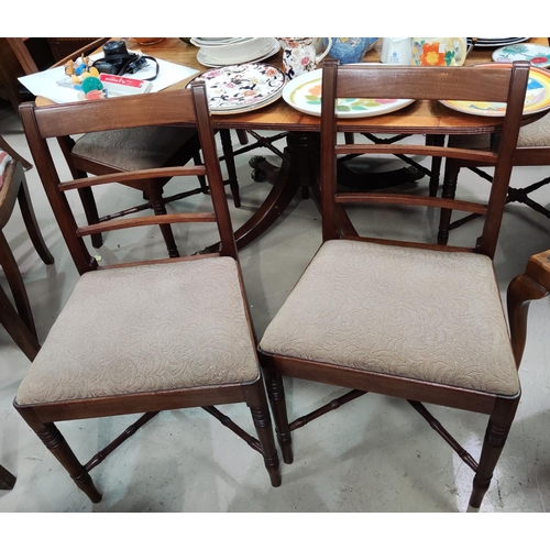 865 - A 19t century set of mahogany dining chairs with wide top rails and drop-in fawn seats, on turned an... 