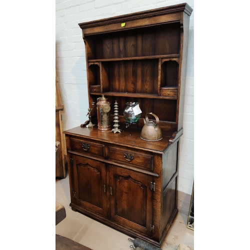 915 - A distressed oak small Welsh dresser in the style of Titchmarsh & Goodwin with 2 spice drawers o... 