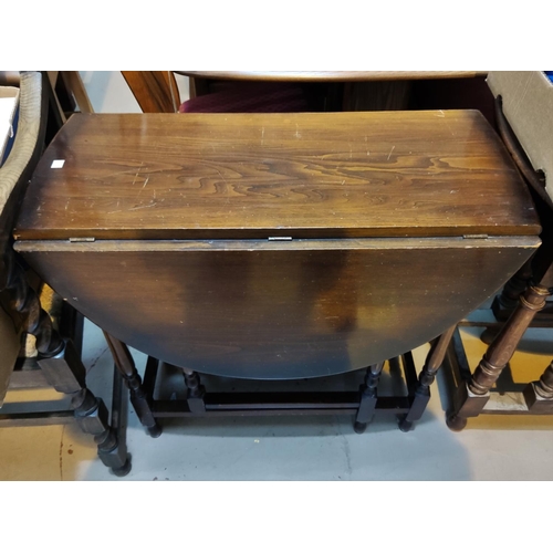 930 - A 1930's drop leaf dining table; a Lancashire spindle back dining chair and 3 19th century ladder ba... 