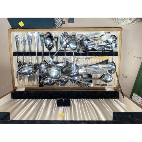 723 - A raised silver on copper dressing table set with floral enamel backs and boxed and loose cutlery