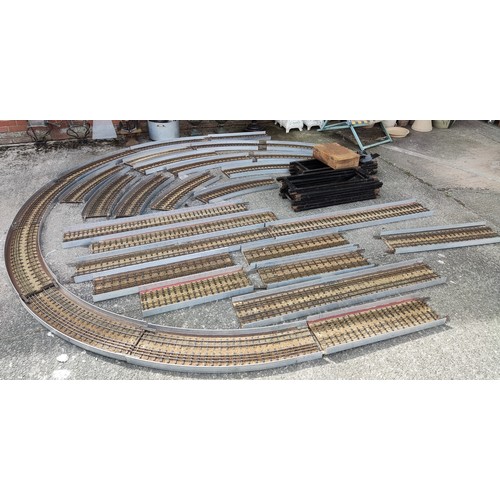 283 - An unusual scratch built 0 gauge train track in circular form with metal stands