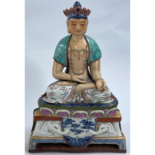 435A - A Chinese ceramic figure of a Buddha in seated lotus position with hole to back possibly for wall ha... 