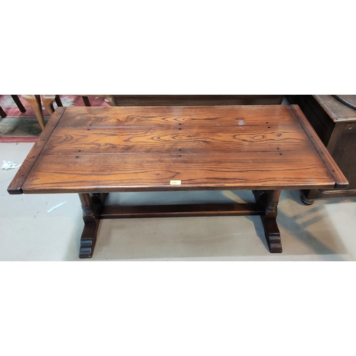 827 - An oak period style coffee table with rectangular, on twin turned end supports