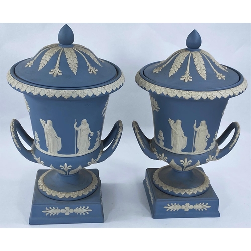 471 - A Wedgwood light blue Jasperware pair of urn shaped vases with covers, height 30 cm