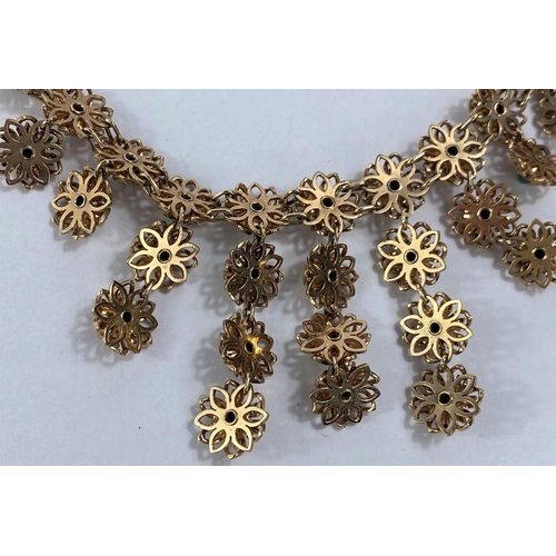 640 - A yellow metal necklace and earring set, each link in the form of a flowerhead mounted with central ... 