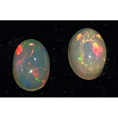 649A - Two oval cabochon cut opals, 1.65 carats
