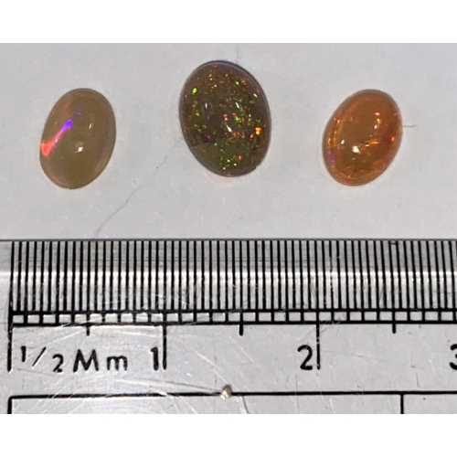 651 - Three oval cabochon cut opals, 1.72 carats