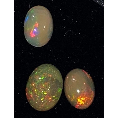 651 - Three oval cabochon cut opals, 1.72 carats