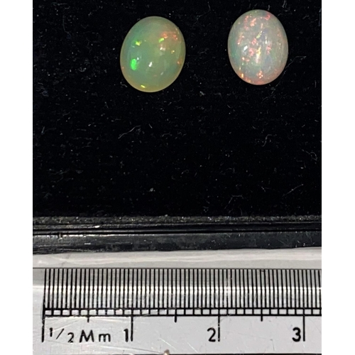 651a - Two cabochon cut opals, 2.2 carats