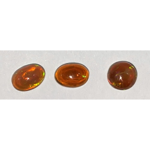 652 - Three oval cabochon cut opals, 1.75 carats