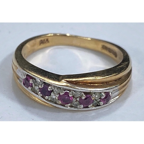 657 - A 9 carat hallmarked gold ring with rubies and diamonds in crossover setting, 3.2 gm