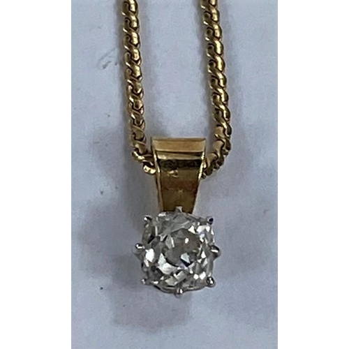 688 - A pendant set single rounded rectangular diamond on fine yellow metal chain, stamped '750', 4.8 gm