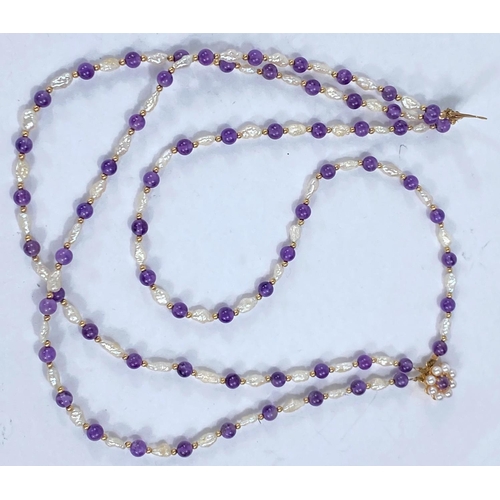 704 - A three strand choker necklace set river pearls amethyst beads, 9ct gold clasp