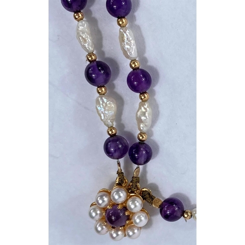 704 - A three strand choker necklace set river pearls amethyst beads, 9ct gold clasp